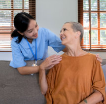 senior woman smiling at the aide