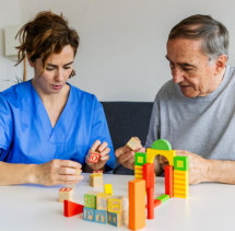 aide and senior woman having an activity