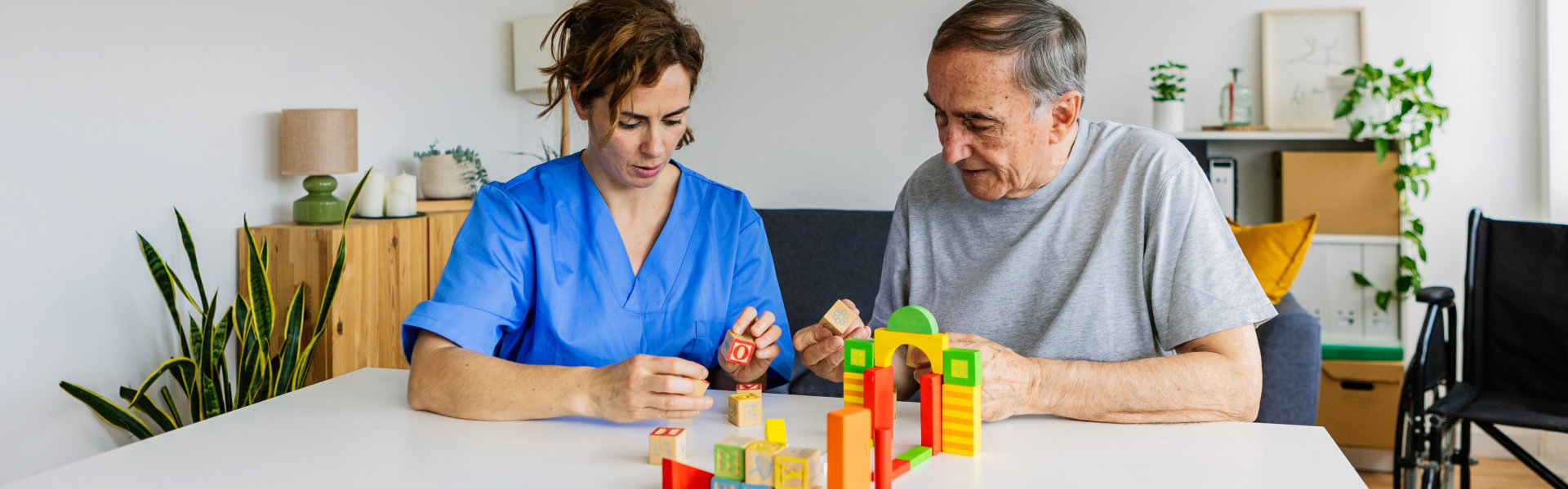 aide and senior woman having an activity