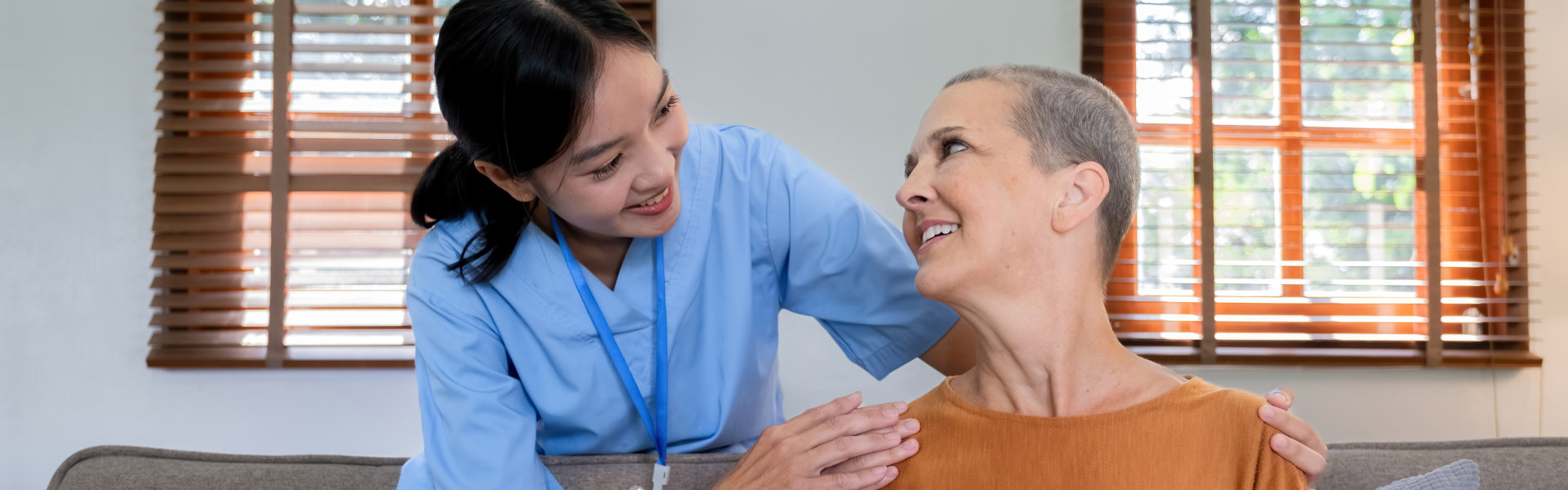 senior woman smiling at the aide