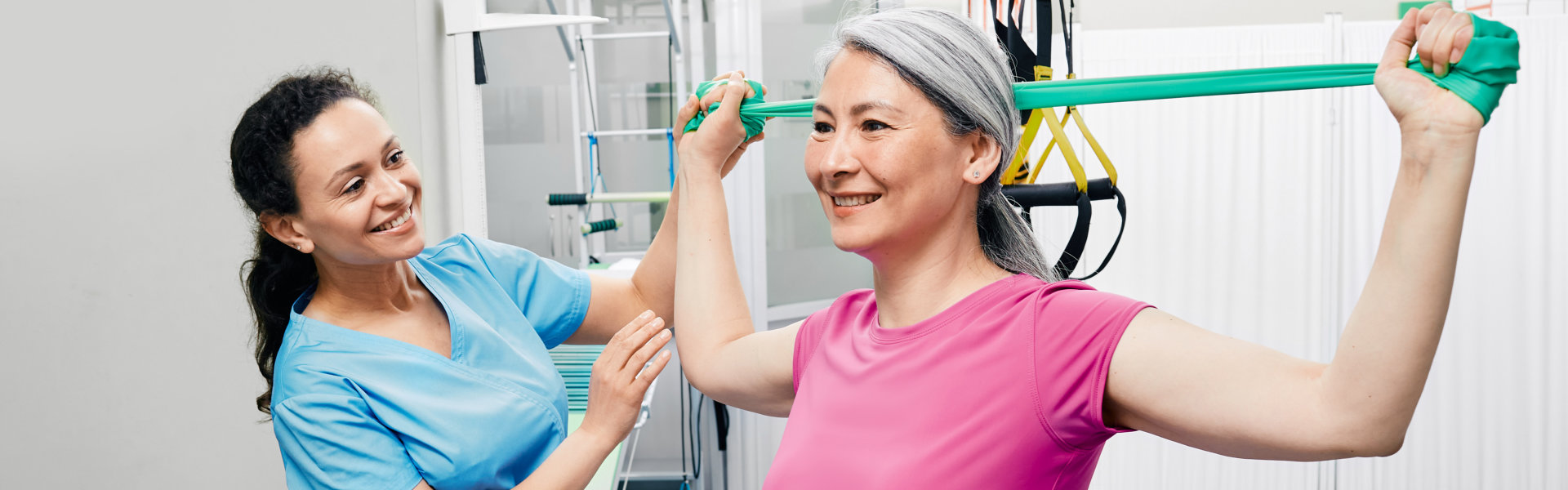 aide and senior woman having a physical therapy